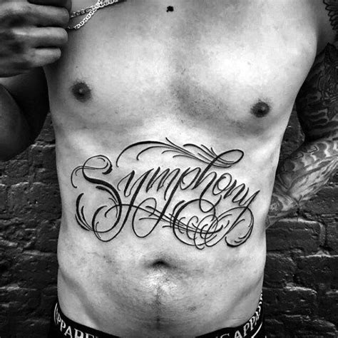 men's lower abdomen tattoos.